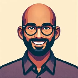 (Illustration) An illustration of a smiling man with glasses and a beard. flat | Colors: #F2D7BD, #4B2B27, #67443C, #261C1A Note: The image is a drawing, not a photograph, and depicts a person in a stylized manner. It's not a logo or banner, and doesn't fit other categories.