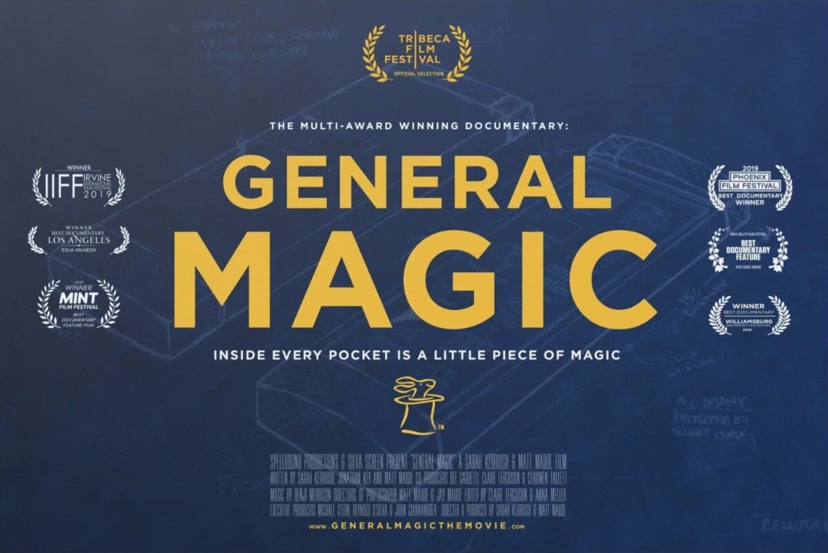 (Banner) A promotional poster for the documentary film 'General Magic', featuring the title in large yellow font over a blue blueprint background of a handheld device. Text: TRIBECA FILM FESTIVAL OFFICIAL SELECTION THE MULTI-AWARD WINNING DOCUMENTARY: GENERAL MAGIC INSIDE EVERY POCKET IS A LITTLE PIECE OF MAGIC WINNER IIFF IRVINE INTERNATIONAL FILM FESTIVAL 2019 WINNER BEST DOCUMENTARY LOS ANGELES FILM AWARDS 2018 WINNER MINT FILM FESTIVAL BEST DOCUMENTARY FEATURE FILM 2019 PHOENIX FILM FESTIVAL BEST DOCUMENTARY WINNER NAPA VALLEY FILM FESTIVAL BEST DOCUMENTARY FEATURE AUDIENCE AWARD WINNER BEST DOCUMENTARY WILLIAMSBURG INDEPENDENT FILM FESTIVAL 2019 SPELLBOUND PRODUCTIONS & SILVA SCREEN PRESENT "GENERAL MAGIC" A SARAH KERBUSH & MATT MAUDE FILM WWW.GENERALMAGICTHEMOVIE.COM Technical, blueprint-inspired, clean, and modern. | Colors: #1e325c, #f3be32, #ffffff Note: The image is a promotional movie poster designed as a banner, featuring structured promotional text, titles, award laurels, and billing information.
