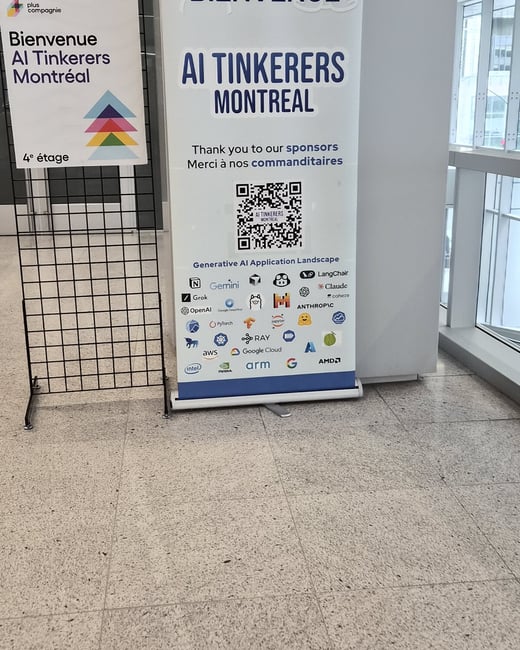 A photograph of a welcome banner and a sign for an 'AI Tinkerers Montreal' event located in a modern indoor hallway.