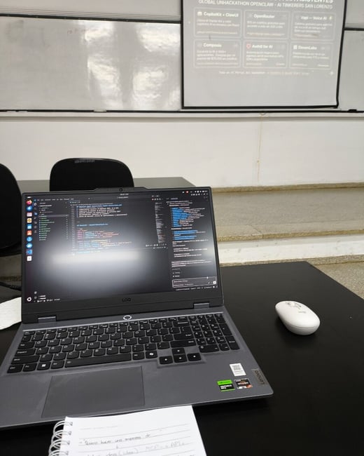 A first-person perspective of a laptop displaying code in a classroom or event space, with a presentation screen showing hackathon benefits in the background.