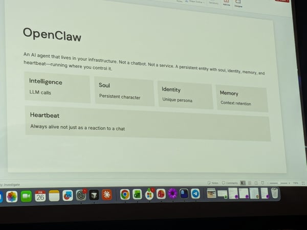 A photograph of a computer screen displaying a presentation slide for 'OpenClaw,' an AI agent, with a macOS dock visible at the bottom.