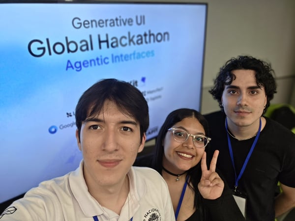 Three young people pose for a selfie in front of a digital screen announcing a 'Generative UI Global Hackathon'.
