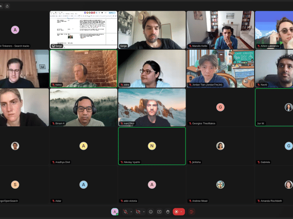 This is a screenshot of a video conferencing session, labeled "Auditorium," displaying a grid layout of approximately 26 participants, many of whom have their cameras active showing various indoor and virtual backgrounds.