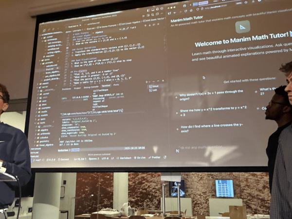 This is a photo of a technical presentation taking place indoors, featuring three young men gathered around a large projection screen displaying a coding environment and a math tutoring application called "Manim Math Tutor."
